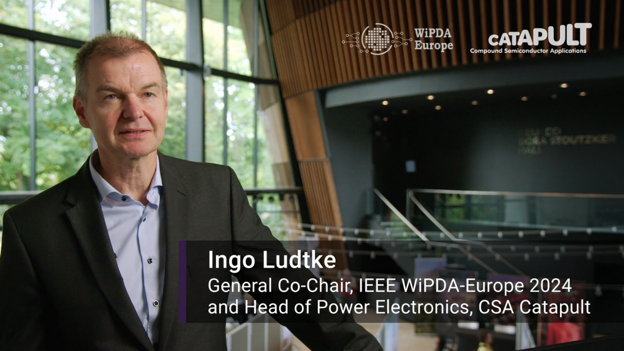 Man in a suit stands in a modern building with glass walls; text identifies him as Ingo Ludtke, a tech industry leader. - CSA Catapult