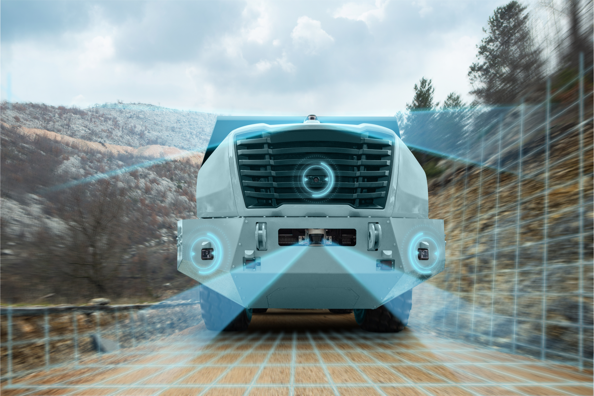 Front view of a futuristic LiDAR truck with digital sensor overlays, on a mountain road. - CSA Catapult